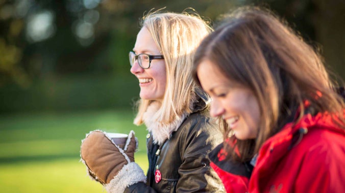 Visitors in winter enjoying a hot drink outside Ickworth, Suffolk